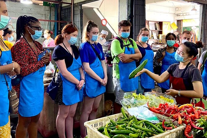 6-Hour Akha Tribe Culture and Cooking Class in Chiang Mai - The kitchen setup: outdoor cooking, AC dinner comfort