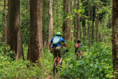 Sticky Waterfall Cycling Tour - Crossing the reservoir by long-tail boat