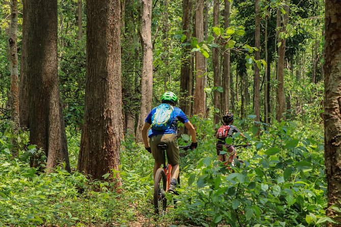 Sticky Waterfall Cycling Tour - Crossing the reservoir by long-tail boat