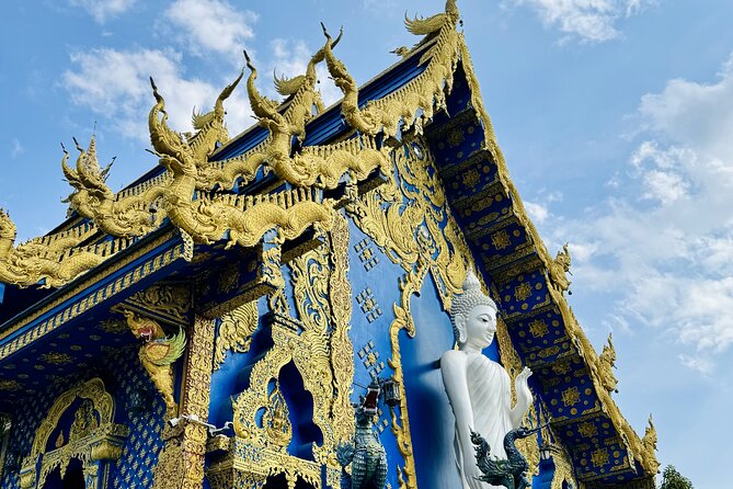 Visit Chiang Rai Temples and Lalitta Cafe from Chiang Mai - Wat Rong Suea Ten (Blue Temple): color, gold details, and a connection to the White Temple