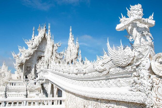 White, Red/Black and Blue Temples Full Day Trip From Chiang Mai - Wat Rong Khun (White Temple): iconic, crowded, and strict about clothes