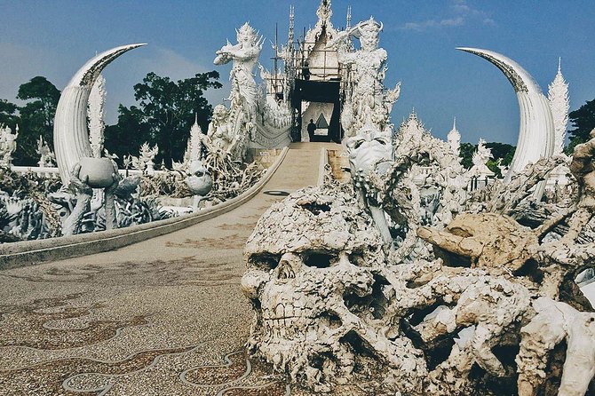 White Temple, Black House Museum and Hot Spring Tour from Chiang Mai (SHA Plus) - Wat Rong Khun (White Temple): Angels, Afterlife, and Symbolic Water